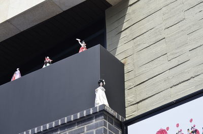 Low angle view of statue against building