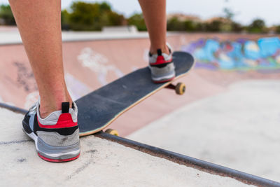 Low section of man skateboarding on skateboard