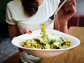 Midsection of woman holding food