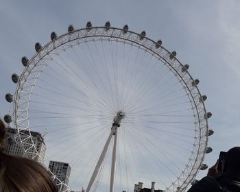 Low angle view of ferris wheel against sky