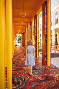 Rear view of woman standing in store