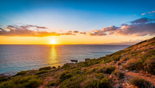 Scenic view of sea against sky during sunset