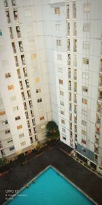 High angle view of swimming pool by building