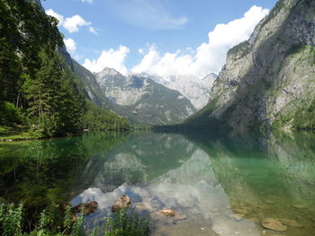 Scenic view of lake and mountains against sky