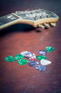 Close-up of guitar on table