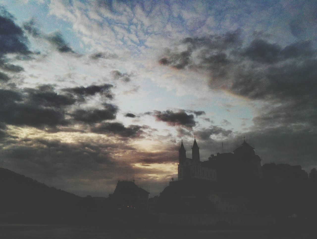 LOW ANGLE VIEW OF SILHOUETTE BUILT STRUCTURES AGAINST SKY