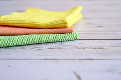 Close-up of yellow shoes on table