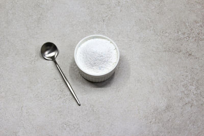 Collagen powder on grey beton background. natural health supplement for skin