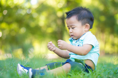 Cute baby boy on grass