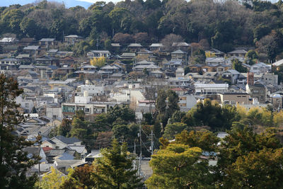 High angle view of townscape and trees in city