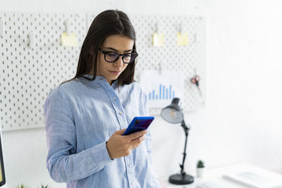 Young woman using mobile phone