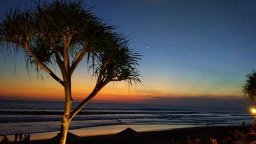 Scenic view of sea against sky at sunset