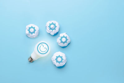 High angle view of coins on white background