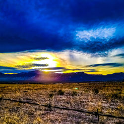 Scenic view of dramatic sky over land