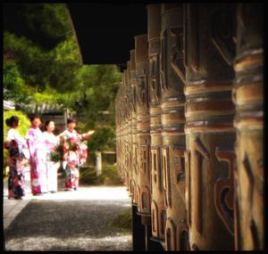 Close-up of people walking on road