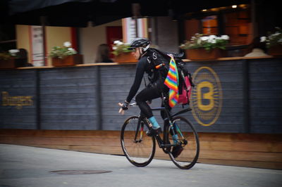 Bicycles riding bicycle on street