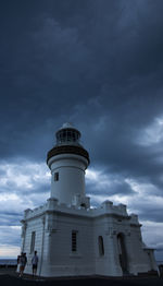 Lighthouse against sky at night