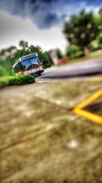 Close-up of car on road