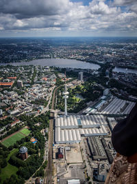 Aerial view of heinrich-hertz-turm tower amidst buildings on sunny day in city