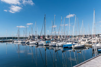 Boats moored at harbor