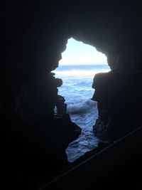 View of sea seen through window