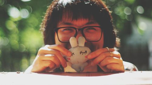 Portrait of smiling girl holding ice cream outdoors