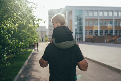 Side view of man standing on road