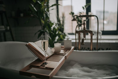 Luxury interior of big bathroom at modern african style with oval bathtub in natural lighting