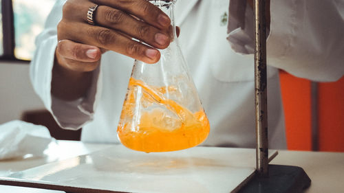 Close-up of man preparing food in kitchen