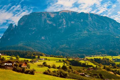 Scenic view of landscape and mountains against sky