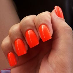 Close-up of woman hand holding red ring