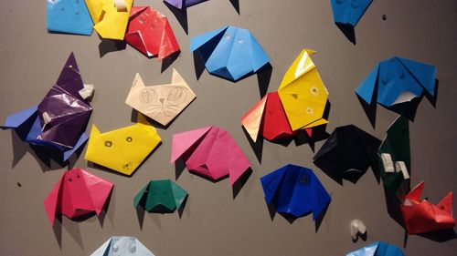 Colorful dogs and cats origami on wall