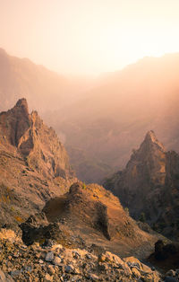 Scenic view of mountains against sky during sunset