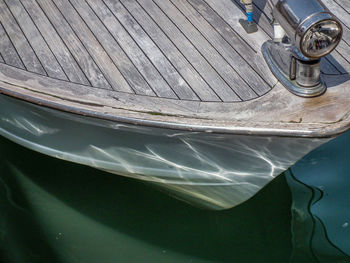 Close-up of boat sailing in water