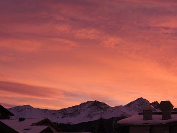 Scenic view of snow covered mountains against sky