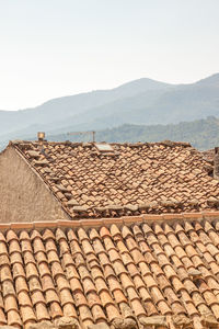 View of roof tiles against sky