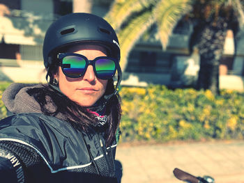 Portrait of a woman on an outdoor bike