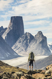 Rear view of backpacker approaching mount asgard akshayak pass, canada