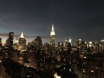 Illuminated buildings in city at night