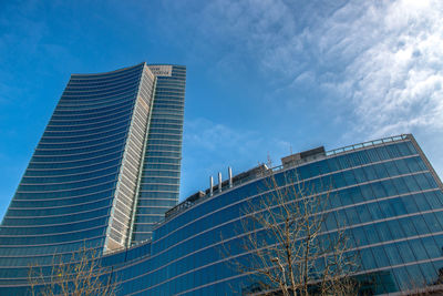 Low angle view of modern buildings against sky