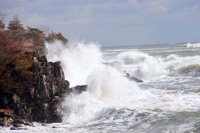 Waves breaking against sea