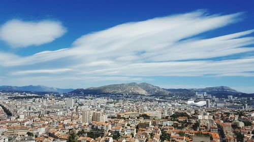 Aerial view of cityscape against sky