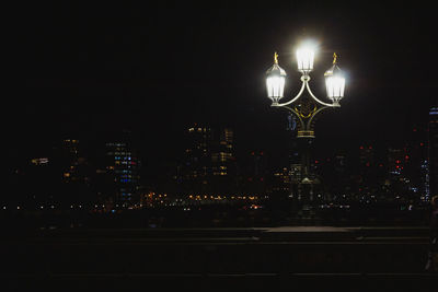 Illuminated buildings in city at night