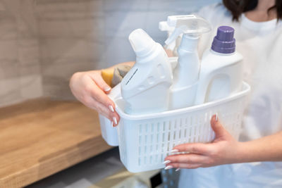 Cropped hand of person cleaning equipment