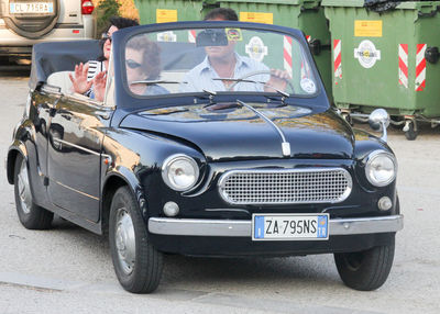 Vintage car parked on road