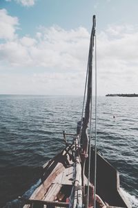 Ship sailing in sea against sky