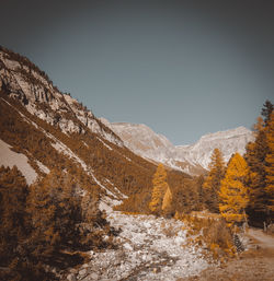 Scenic view of snowcapped mountains against clear sky