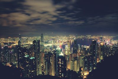 High angle view of city lit up at night