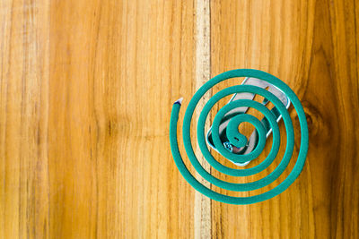 Directly above shot of rope on wooden table