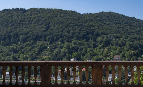  balcony edge in the city of heidelberg.    mountains against sky